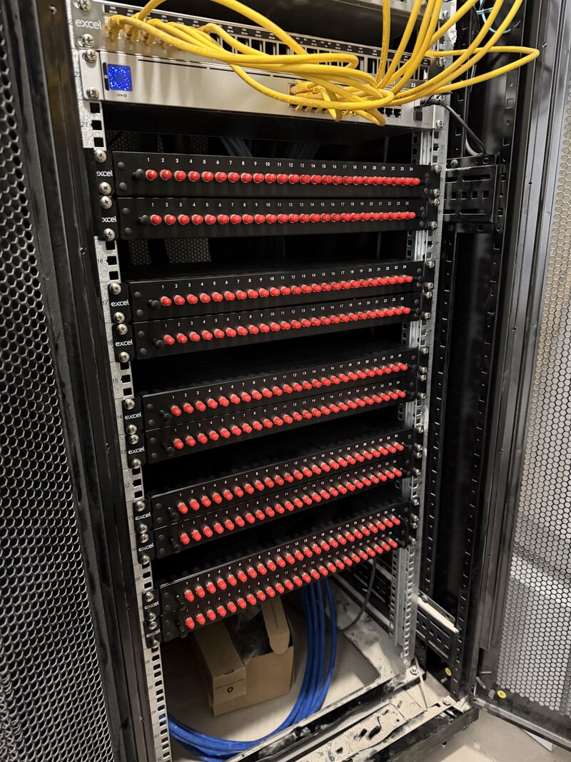 Fibre patch panels with red connectors terminated and tested