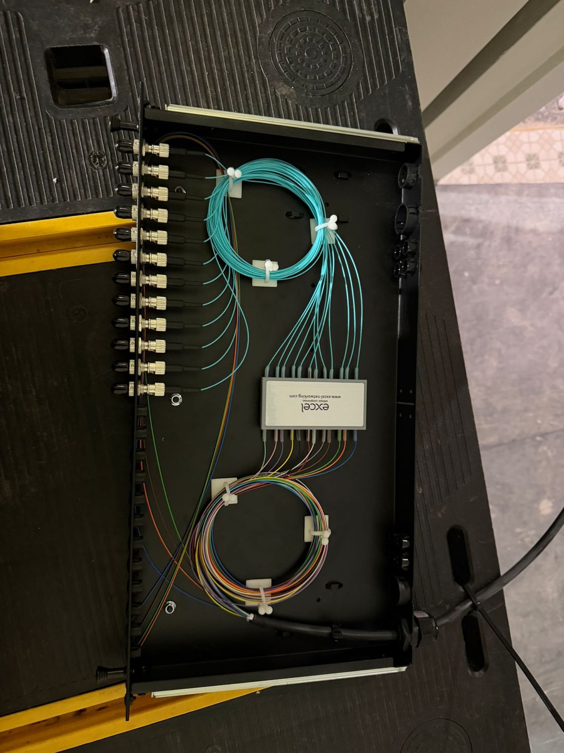 Fibre tray terminated and labelled inside a cabinet