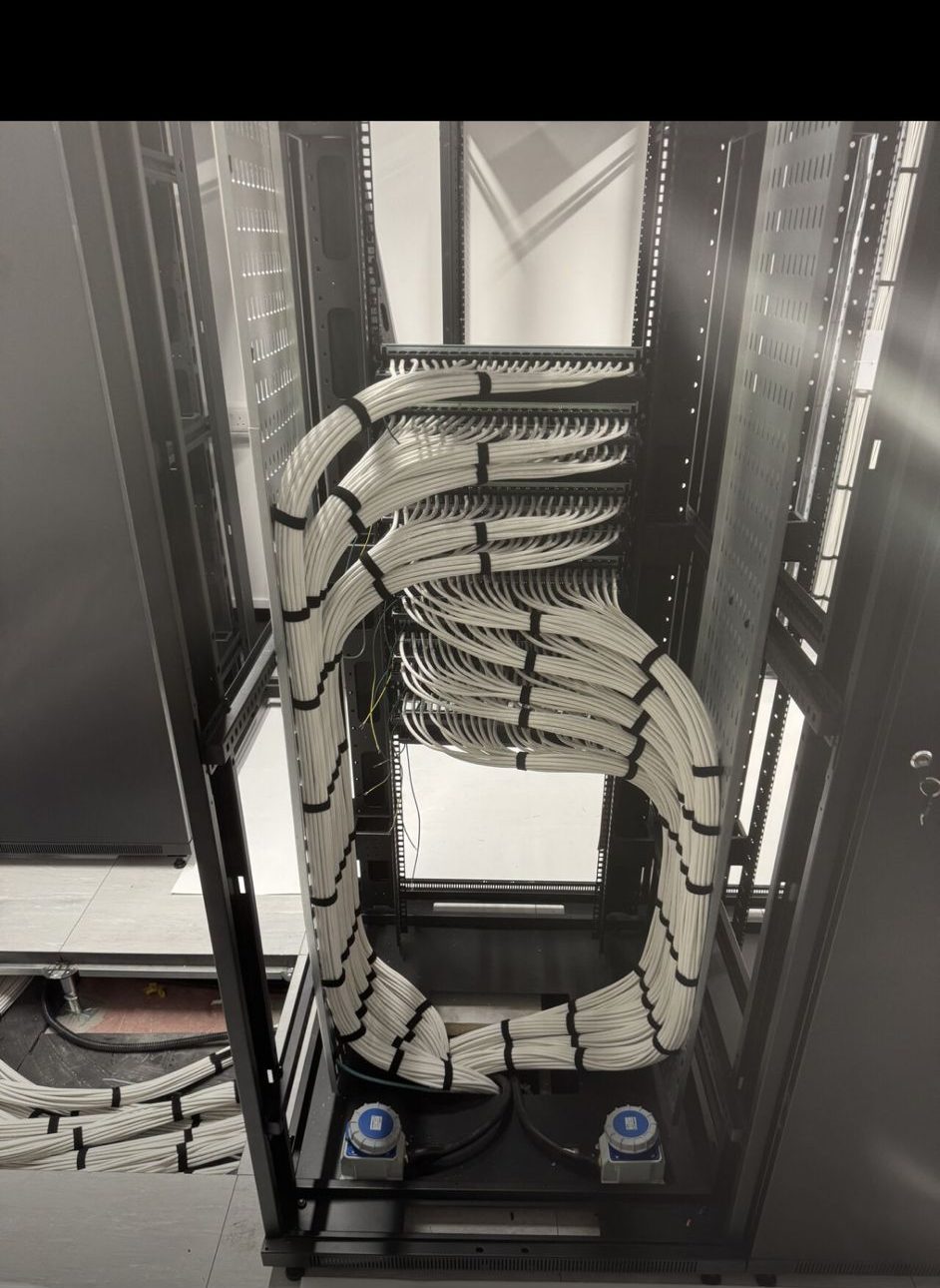 Vertical cable management spine inside a server cabinet