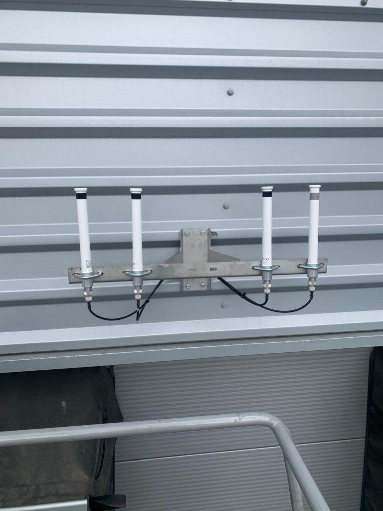 External antenna array installed on industrial cladding
